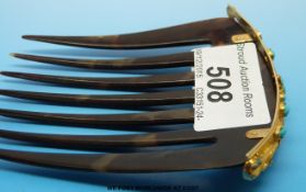 A Pierce and Dalton hair comb,
