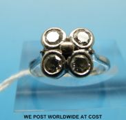 An 18ct gold ring set with four round brilliant cut diamonds each approximately 0.