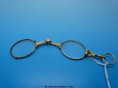 A pair of yellow metal lorgnettes
