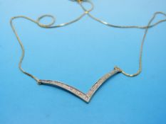 A 9ct gold necklace set with diamonds in a wishbone shape