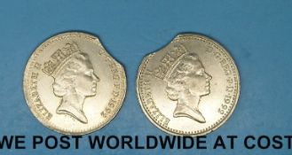 Two 1992 10 pence coins with cutaway edges where they may have missed the die