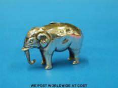 A hallmarked silver pin cushion in the form of an elephant (length 4.