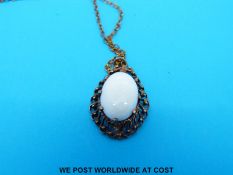 A 9ct gold pendant set with an oval opal