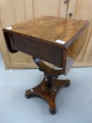 A Victorian rosewood fall-flap work table with single drawer raised on a turned column and bun feet