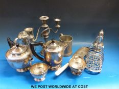 A large collection of plated ware including salvers, tea ware, cased fish cutlery, egg cruet,