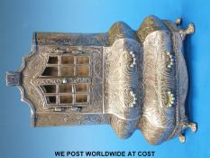 A Dutch white metal miniature bookcase with opening doors and drawers,