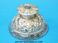 A Victorian hallmarked silver and hobnail cut glass inkwell with pierced and embossed,