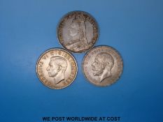 An 1887 Victorian jubilee head crown together with a 1935 rocking horse crown and a 1937 George VI