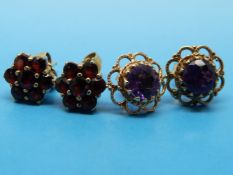 Two pairs of 9ct gold earrings,