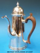 A Victorian hallmarked silver chocolate pot of Georgian design with wooden handle (Britannia