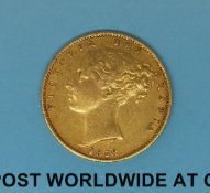 An 1858 young head gold full sovereign shield reverse