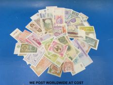 Fifty mixed world banknotes including Iraq, Egypt, Brazil, Afghanistan, Armenia,