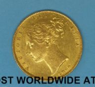An 1869 young head gold full sovereign, shield back,