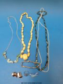 A large ivory necklace, two pearl necklaces, white metal and turquoise necklace,