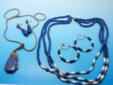 A silver necklace set with lapis lazuli and marcasite,