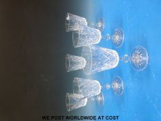 A set of six Mappin & Webb wine glasses with cut decoration in original box