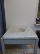 A marble mortar in marble surround (H88 x 86cm square)