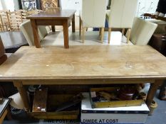 An oak kitchen /dining table raised on turned legs (height 77cm length 215cm width 90cm)