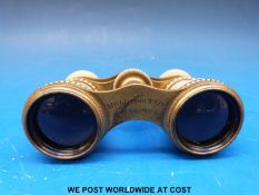 A pair of ivory and brass 19thC opera glasses with beaded decoration,