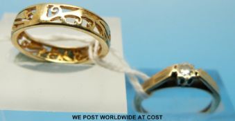 Two 9ct gold rings one a diamond solitaire the other a pierced band set with four diamonds