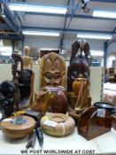 A collection  of turned wood and treen items including an artist's figure, other figures, masks,