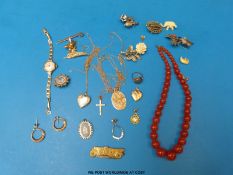A collection of jewellery including 9ct gold heart locket, 9ct gold watch, 9ct gold earrings,