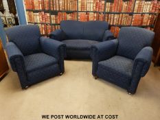 A blue floral three piece suite.