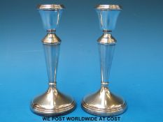A pair of hallmarked silver candlesticks, B'ham maker C and N for Cristford and Norris (height 14.