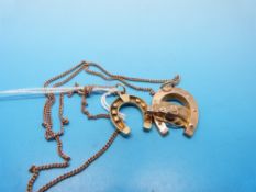Two 9ct gold horseshoe pendants and a chain (8.