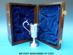 A cased hallmarked limited edition (464/2000) silver jug commemorating the 350th anniversary of the