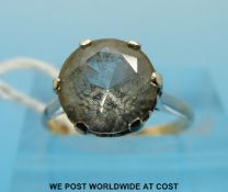 A 9ct gold ring set with a large round brilliant cut zircon (size L/K)