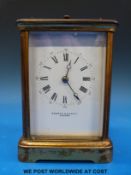 A brass carriage clock by Rowell and Harris Oxford, striking on a gong,