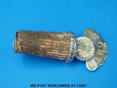 A George V hallmarked silver bottle stopper with shell below 