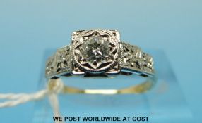 An 18ct gold ring set with a round brilliant cut diamond in an illusion setting with stepped