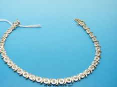 A 9ct gold bracelet set with diamonds