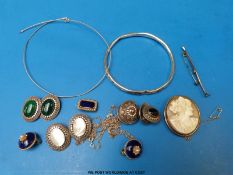 A small collection of jewellery to include silver flapper bangle, Victorian brooch set with pearls,