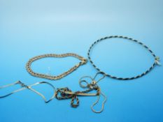 Two yellow metal bracelets,