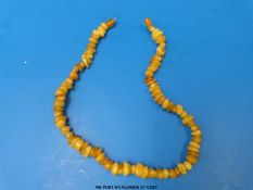 An amber necklace formed of irregular shaped beads
