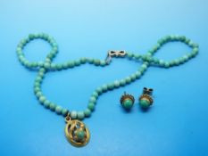 A beaded turquoise necklace a yellow metal pendant set with a turquoise and a pair of 9ct gold and