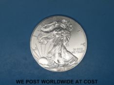 A 2015 siver proof American Eagle dollar