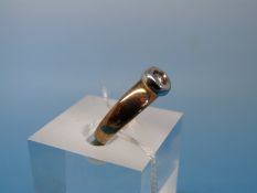 A 9ct gold and platinum ring set with a single diamond (size P)