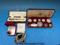 A cased set of 1953 coronation proof coins, pearl necklace, ring and a cased silver gilt spoon.