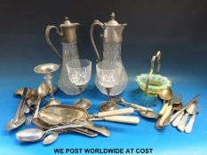 A quantity of silver plate to include claret jugs etc, some flatware with silver collars,
