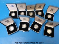Nine silver proof UK one pound cased coins with certificates 2001-2006,