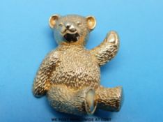 A 9ct gold brooch in the form of a teddy bear