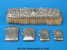 Four hallmarked silver vesta cases and a silver-backed hairbrush