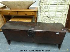 A 17thC small elm coffer or sword box, each aspect of single plank construction,