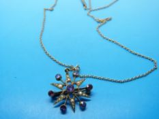 An Edwardian 9ct gold pendant set with seed pearls and amethysts with chain