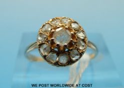 A 9ct gold ring set with diamonds in a cluster (size L)