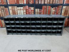 A vintage set of shopfitting / haberdashery / engineer's metal cubby holes with brass ticket